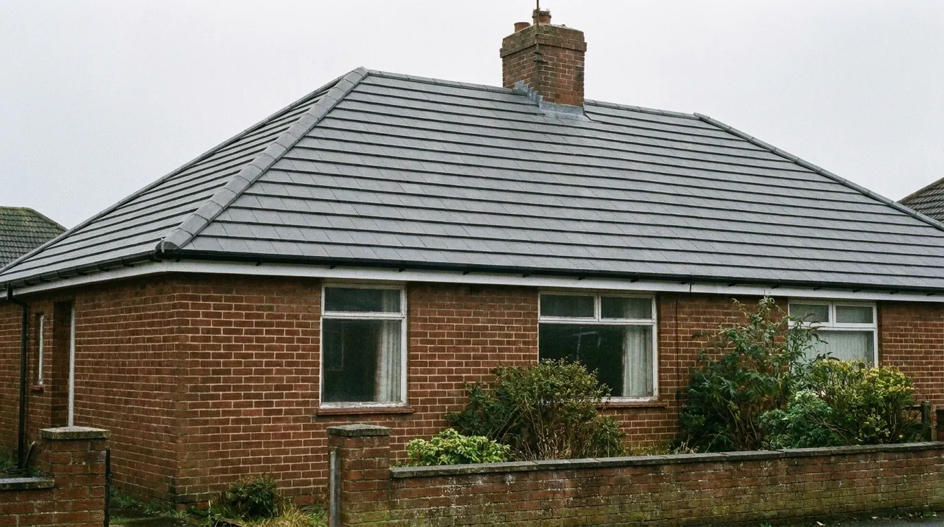 The same house with a new tiled roof, repointed chimney and new roofline